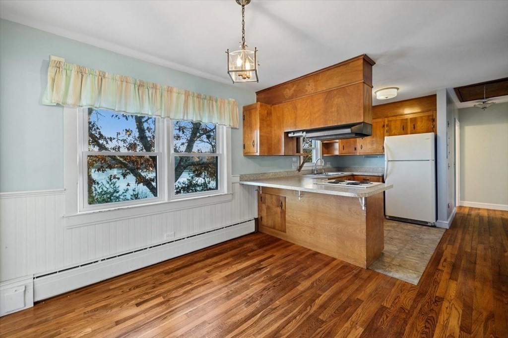 12 Nye Lane Bourne, MA 02532 - Photo 20 of 38 a kitchen with stainless steel appliances a stove refrigerator and microwave