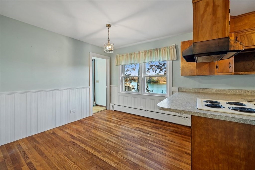 12 Nye Lane Bourne, MA 02532 - Photo 22 of 38 a view of a livingroom with wooden floor and a ceiling fan