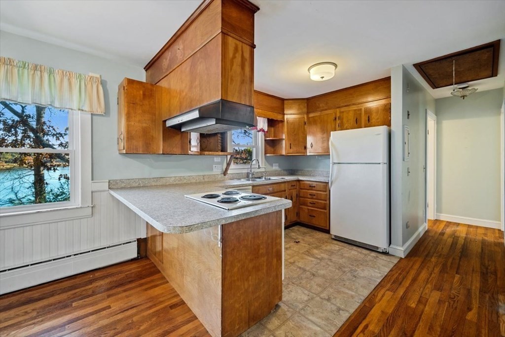 12 Nye Lane Bourne, MA 02532 - Photo 23 of 38 a kitchen with a sink appliances and cabinets