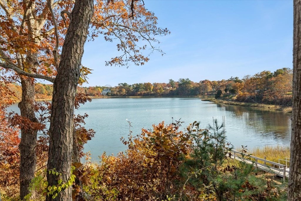12 Nye Lane Bourne, MA 02532 - Photo 35 of 38 a view of a lake with houses in the back
