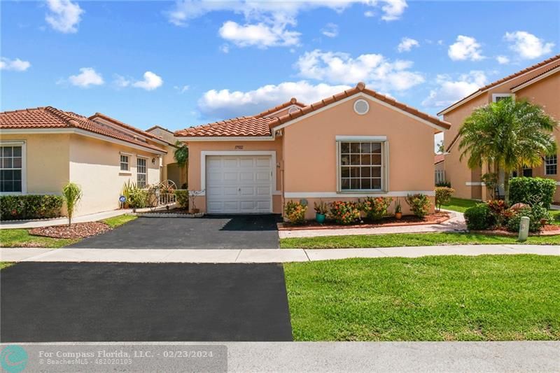 17922 Southwest 11th Street Pembroke Pines, FL 33029 - Photo 1 of 19 a view of a house with a yard and potted plants
