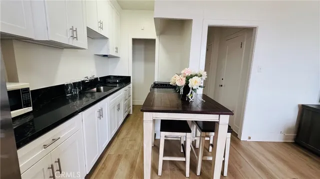 a kitchen with a sink and a refrigerator
