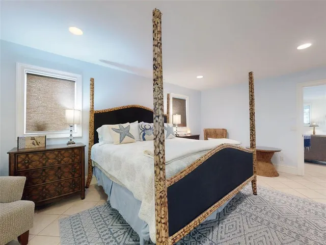 a bed room with bed and window