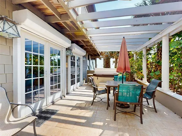 a outdoor space with a large window and furniture