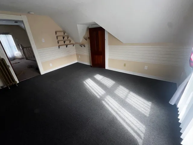 a view of a hallway with windows