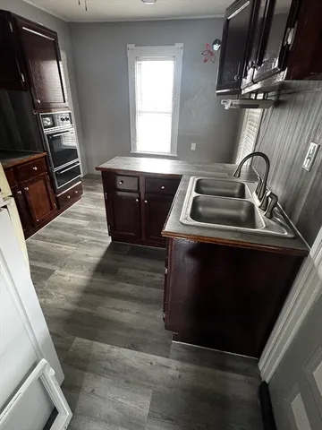 a kitchen with a stove and a microwave