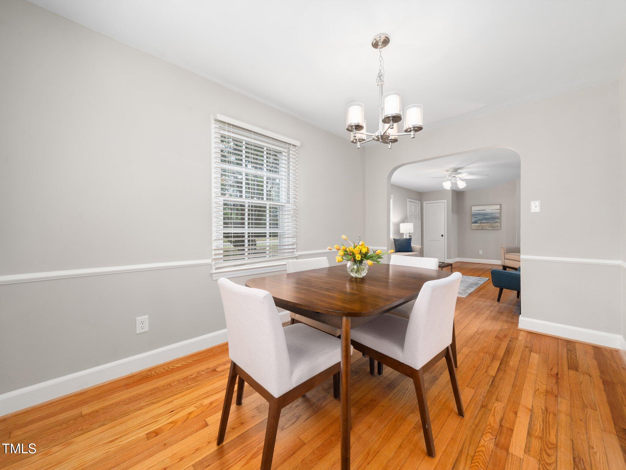 1313 Ridge Road Raleigh, NC 27607 - Photo 12 of 37 a view of a dining room with furniture and chandelier