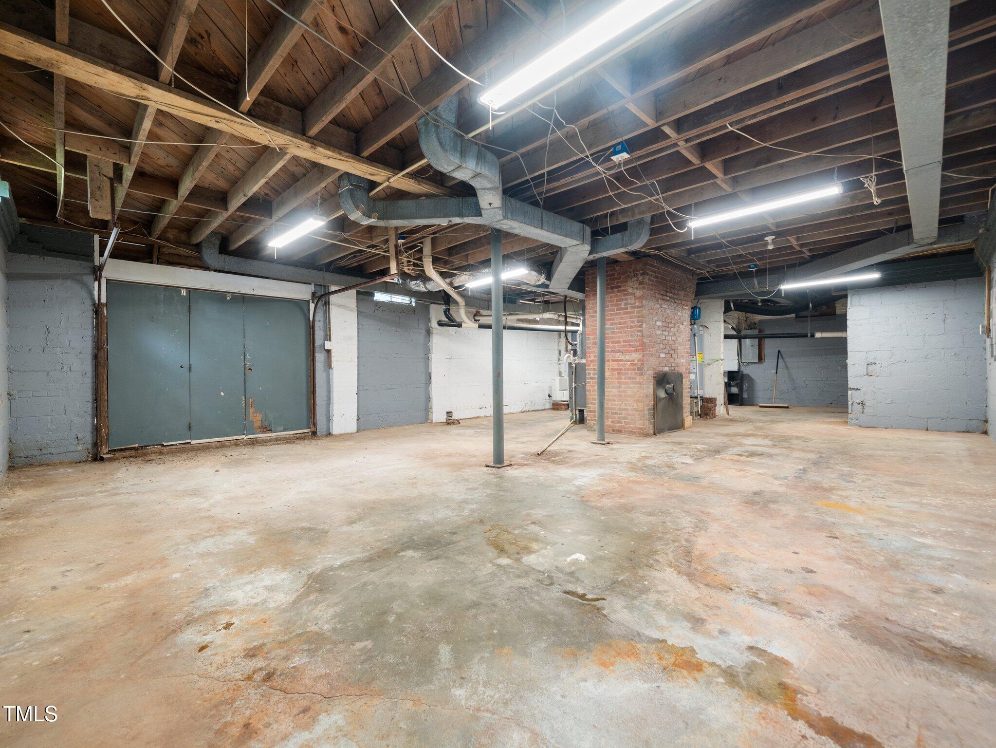 1313 Ridge Road Raleigh, NC 27607 - Photo 27 of 37 a view of empty room with wooden ceiling
