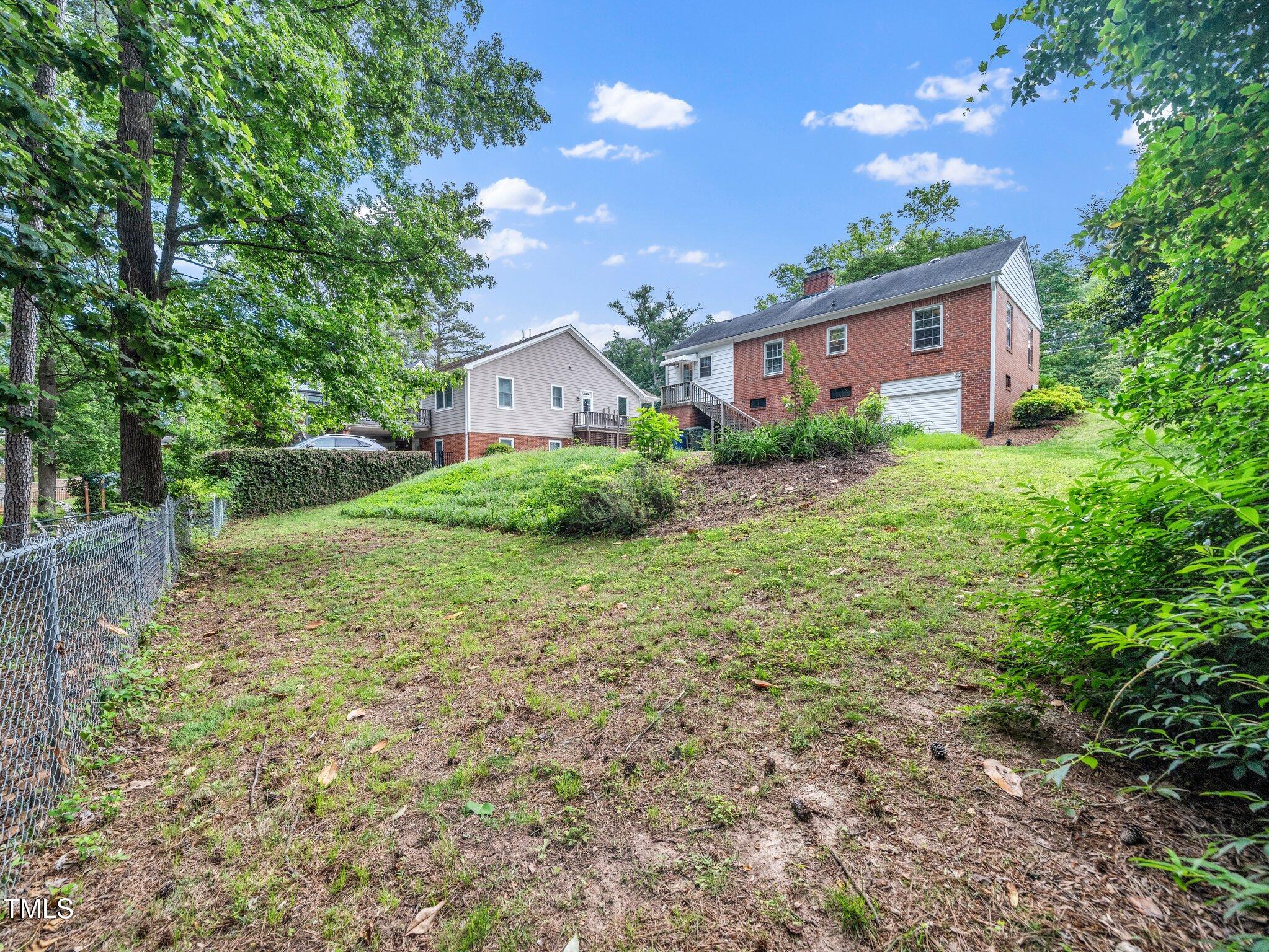 1313 Ridge Road Raleigh, NC 27607 - Photo 30 of 37 a view of a house with a yard and tree s
