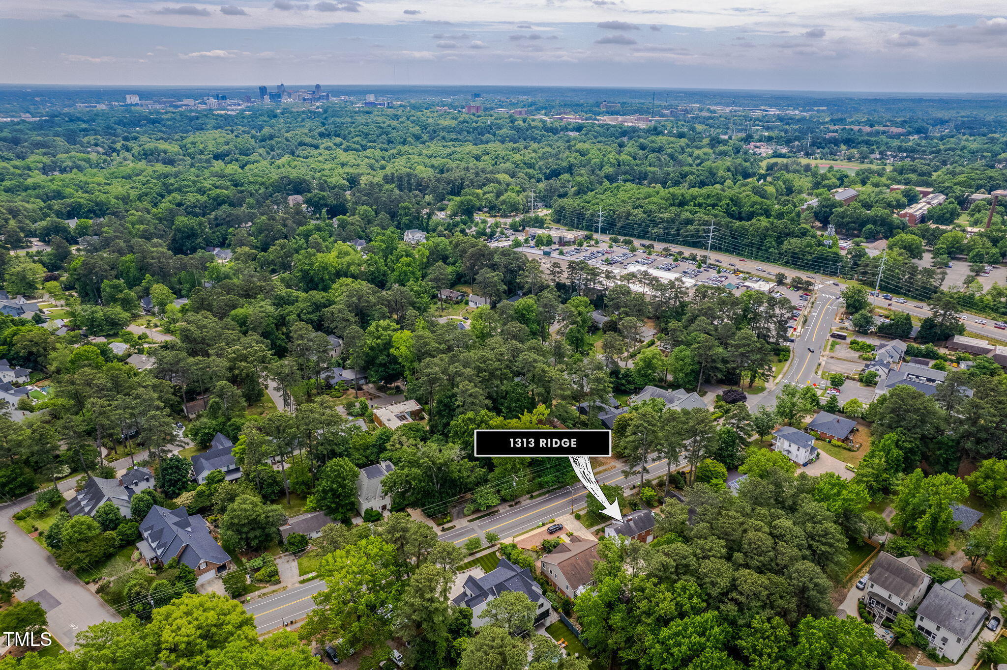 1313 Ridge Road Raleigh, NC 27607 - Photo 34 of 37 an aerial view of a house with a yard