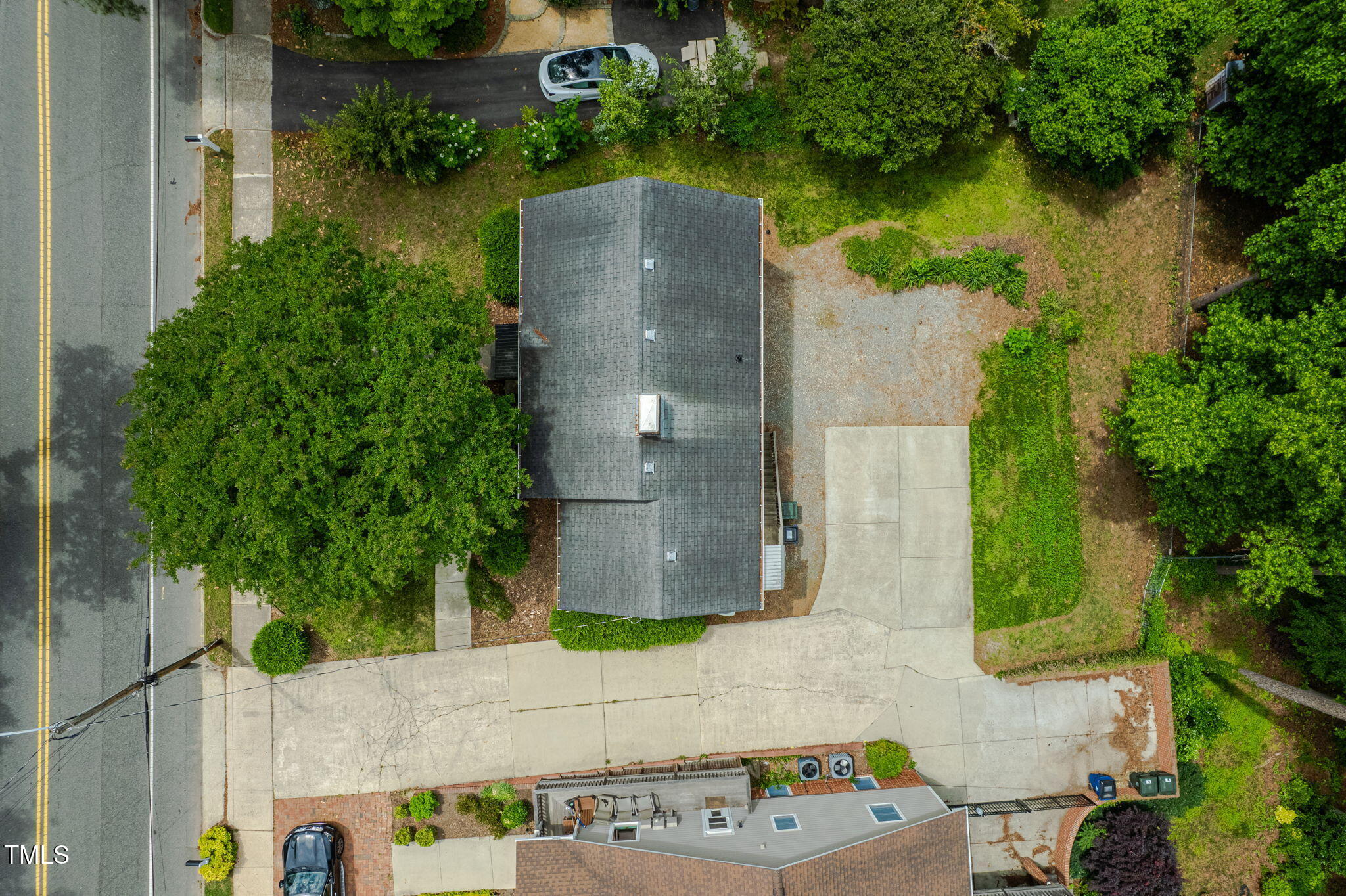 1313 Ridge Road Raleigh, NC 27607 - Photo 35 of 37 an aerial view of a house with a yard and a fountain
