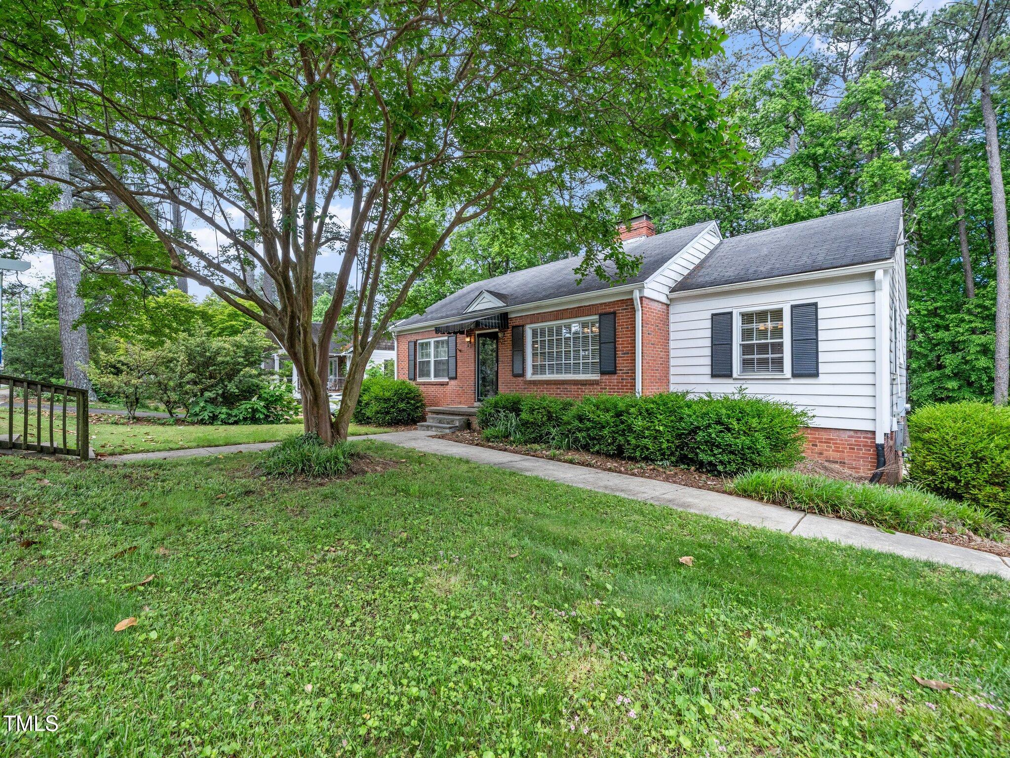 1313 Ridge Road Raleigh, NC 27607 - Photo 4 of 37 a house view with a garden space
