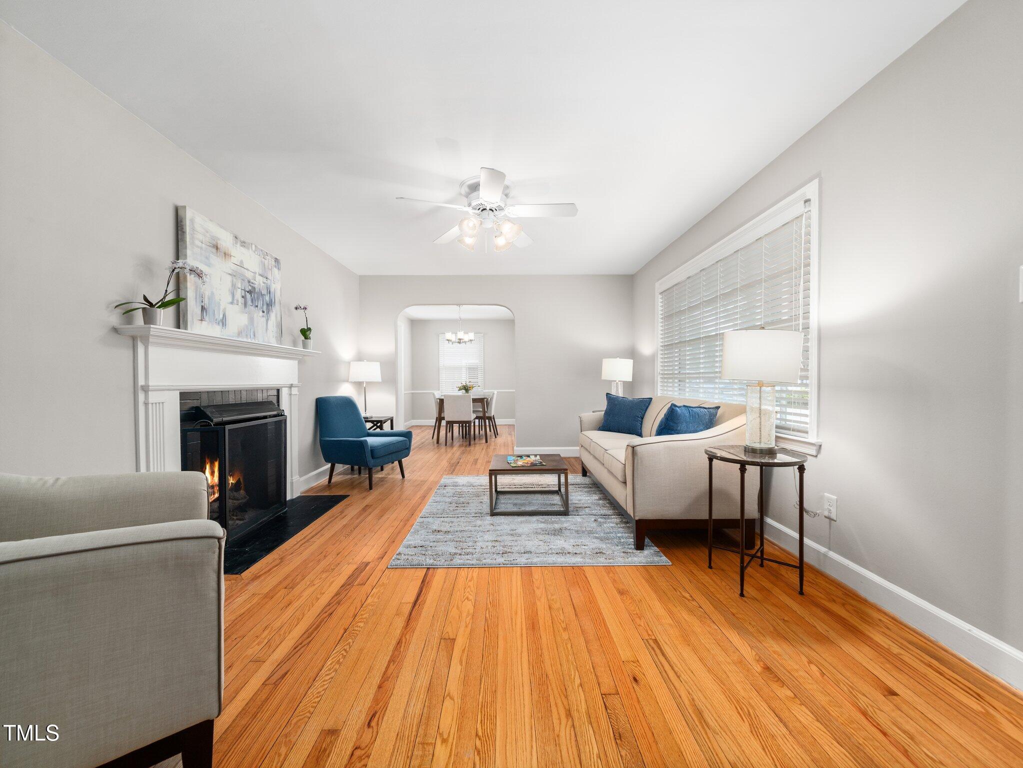 1313 Ridge Road Raleigh, NC 27607 - Photo 6 of 37 a living room with furniture and a fireplace