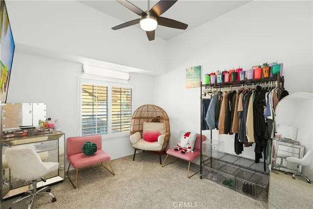 a bedroom with furniture and a window