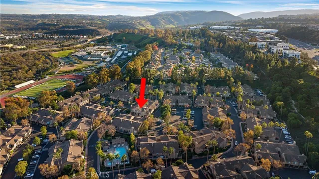 a view of a city with mountains in the background