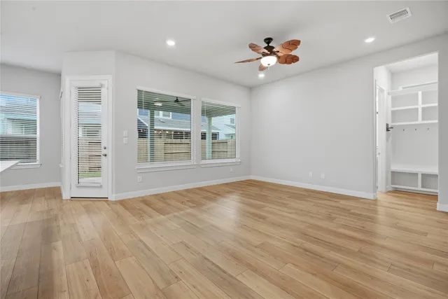 a view of large kitchen with granite countertop cabinets and stainless steel appliances
