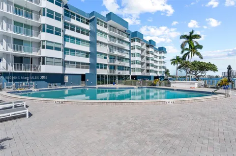 a view of a swimming pool with a terrace