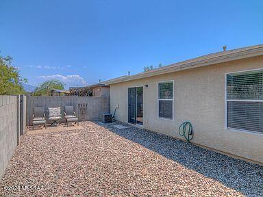 3248 West Treece Place Tucson, AZ 85742 - Photo 16 of 17 a backyard of a house with table and chairs