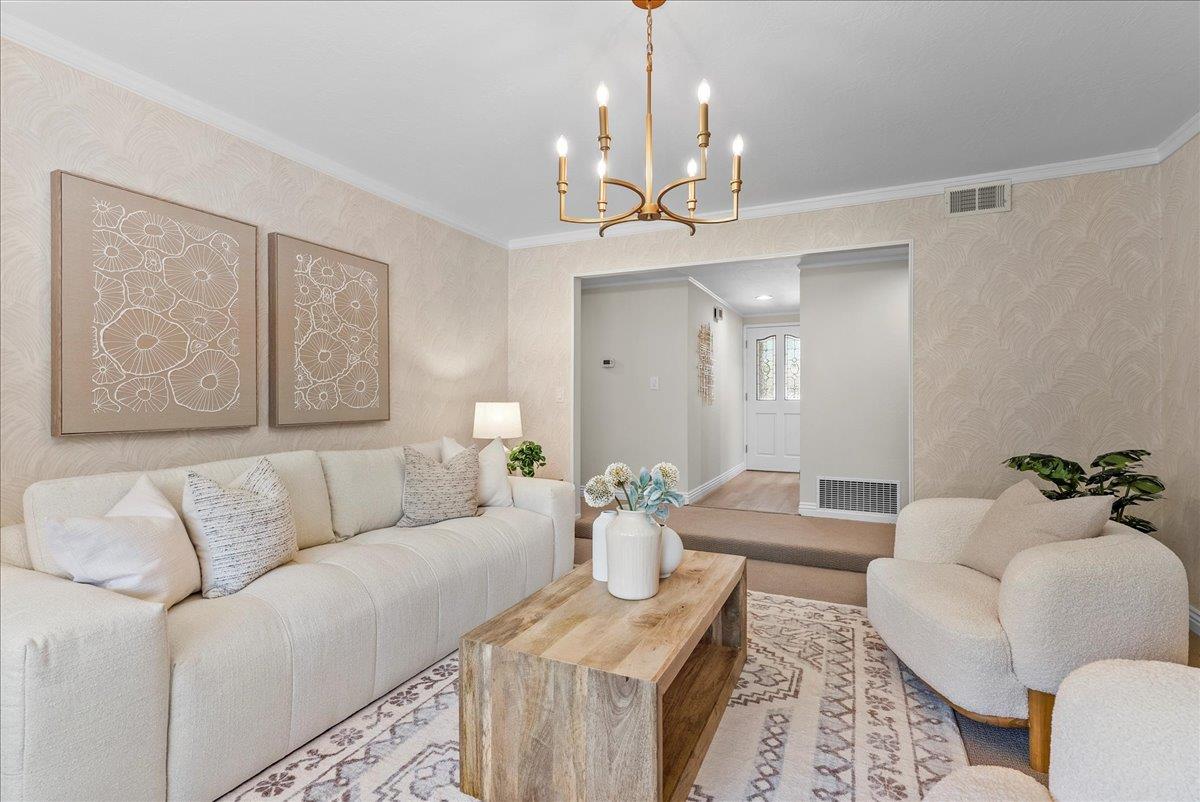 1648 Mt Rainier Avenue Milpitas, CA 95035 - Photo 15 of 34 a living room with furniture and a chandelier