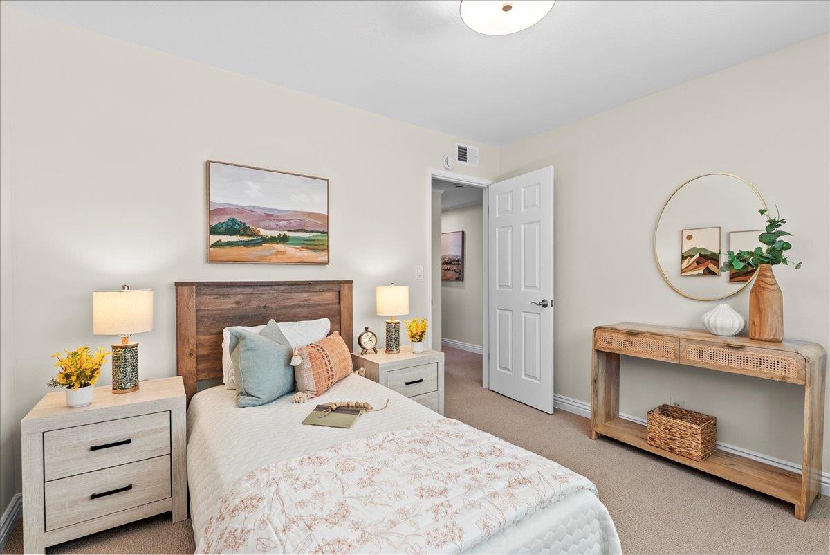 1648 Mt Rainier Avenue Milpitas, CA 95035 - Photo 21 of 34 a bedroom with a bed and a dresser