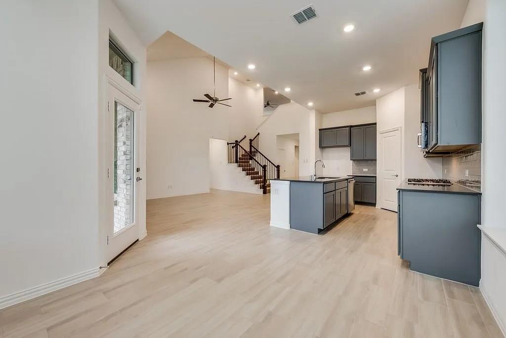 3900 Falcon Field Mesquite, TX 75181 - Photo 3 of 12 a kitchen with stainless steel appliances a refrigerator and a sink