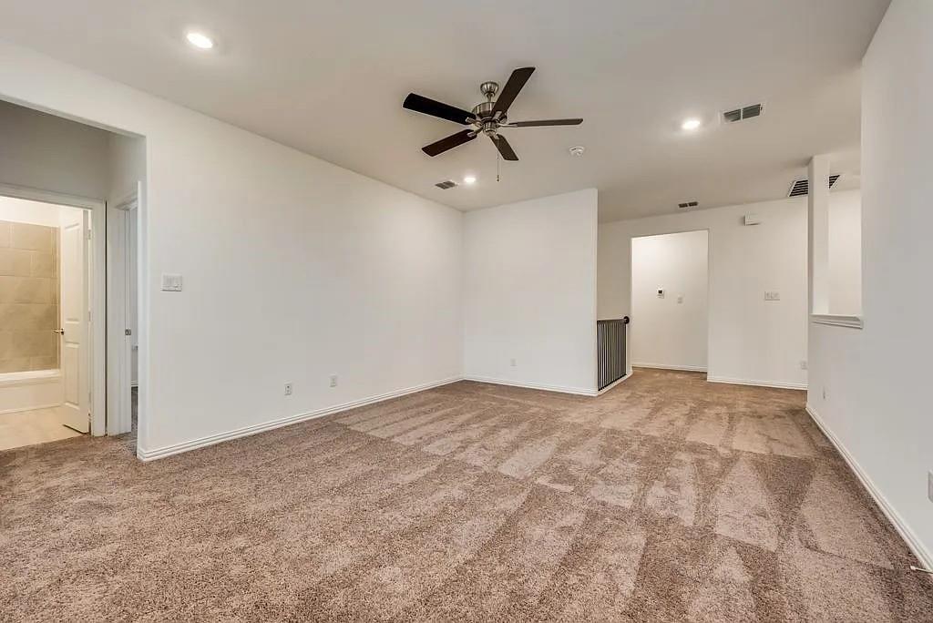 3900 Falcon Field Mesquite, TX 75181 - Photo 9 of 12 a view of a livingroom with a ceiling fan & window
