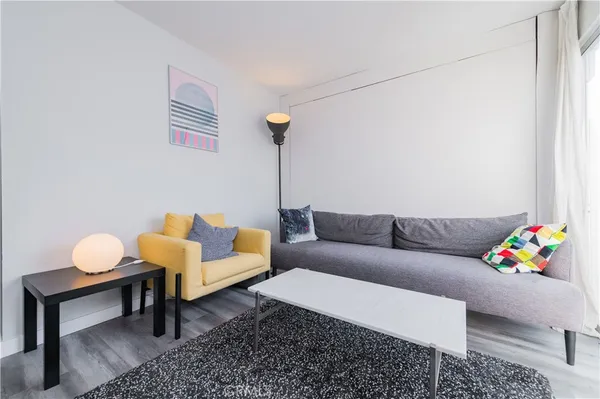 a living room with a fireplace and a flat screen tv