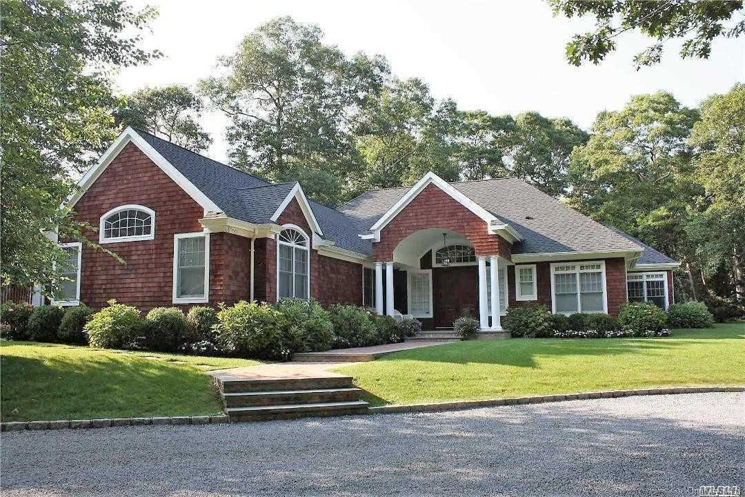191 South Country Road Remsenburg, NY 11960 - Photo 1 of 1 a front view of a house with a yard