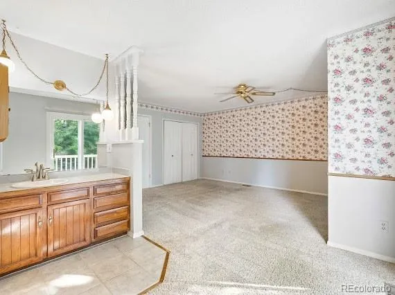 a view of a kitchen with furniture and staircase