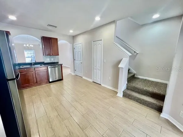 a view of living room with furniture and flat screen tv