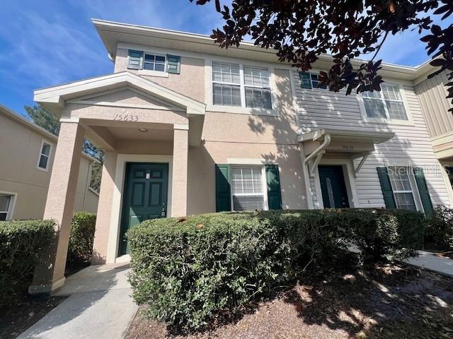 15633 Stable Run Drive Spring Hill, FL 34610 - Photo 2 of 50 a front view of a house with a garden