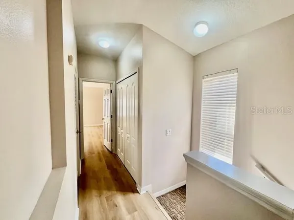 a view of a room with a flat screen tv