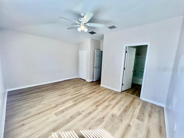 15633 Stable Run Drive Spring Hill, FL 34610 - Photo 23 of 50 a view of a room with wooden floor and ceiling fan