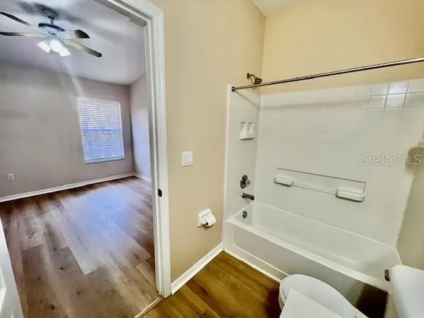 a bathroom with a shower and a toilet