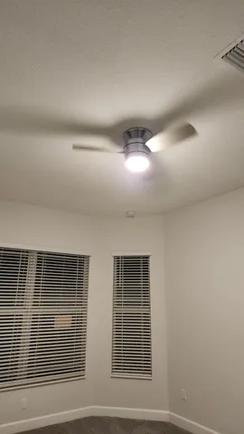 a view of empty room with windows