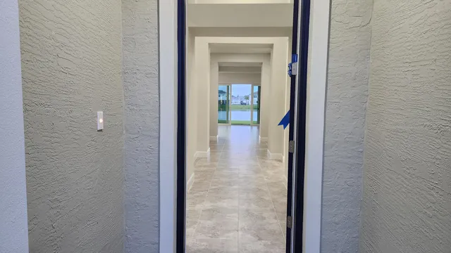 a view of a bathroom from a hallway