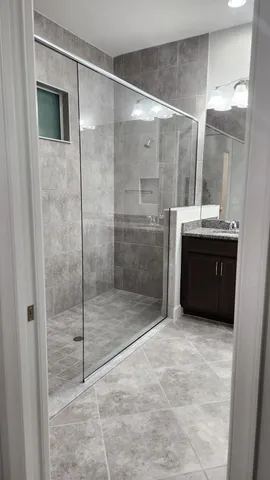 a swimming pool with a lake in the background