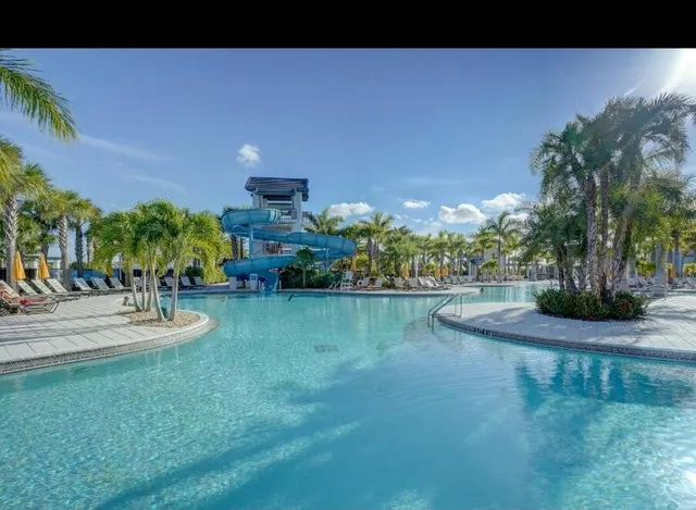 a view of potted plants with sign board