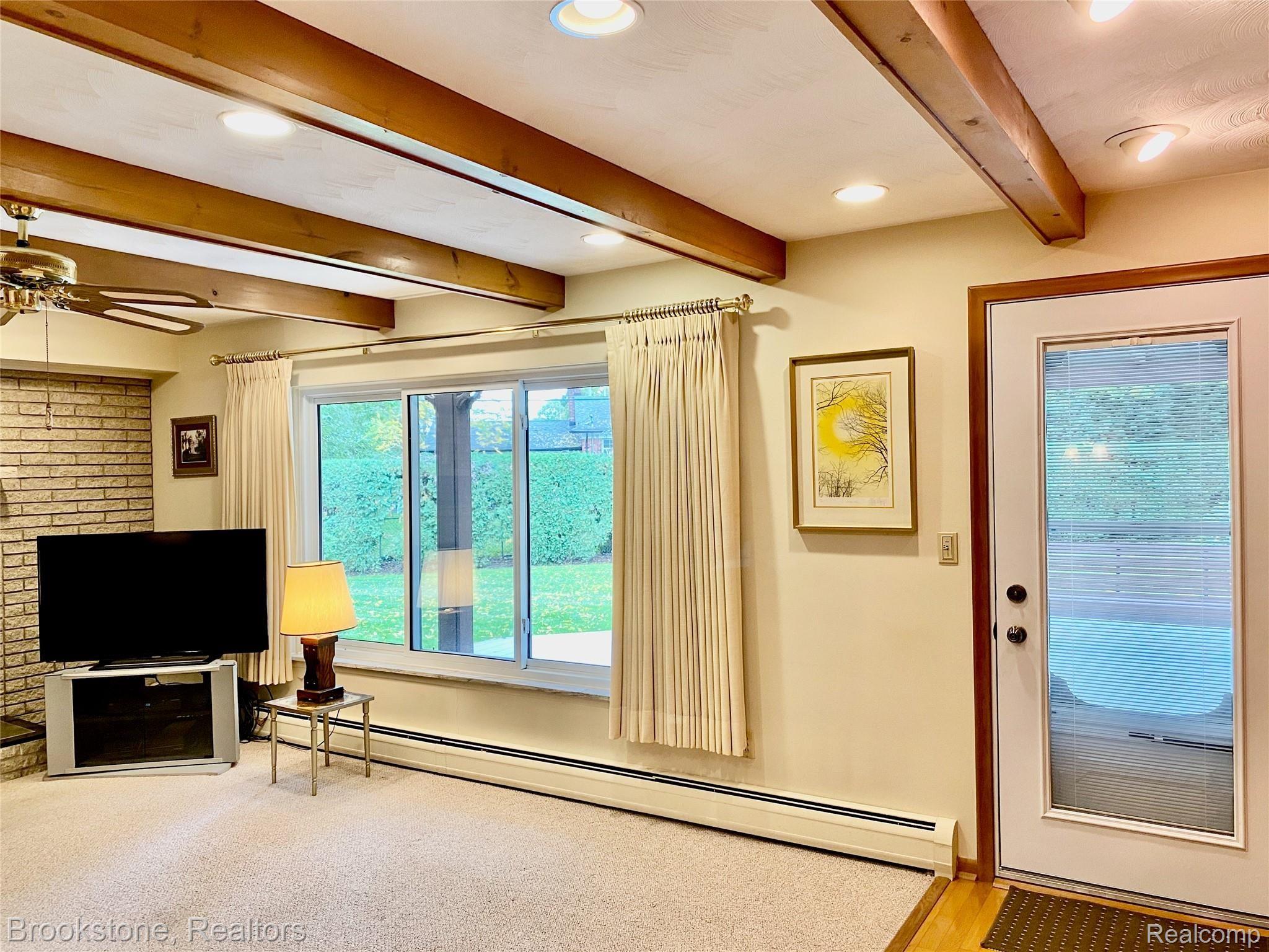 838 Wilwood Road Rochester, MI 48309 - Photo 29 of 53 THE EXTERIOR DOOR LEADS TO THE LARGE DECK (20X30) WITH A LARGE PORTICO (15X20) THAT WAS "DESIGNED FOR ENTERTAINING"