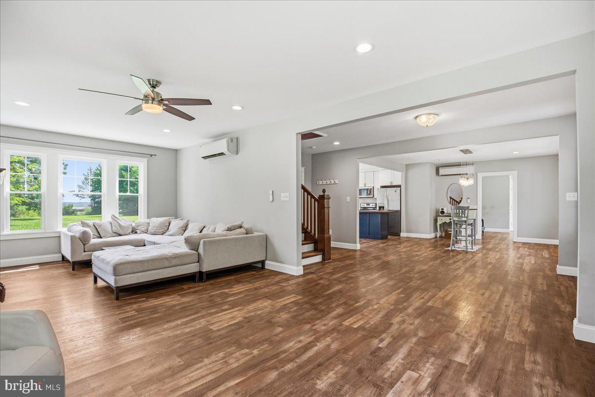 16146 Thomas Road Piney Point, MD 20674 - Photo 28 of 70 a living room with furniture and wooden floor
