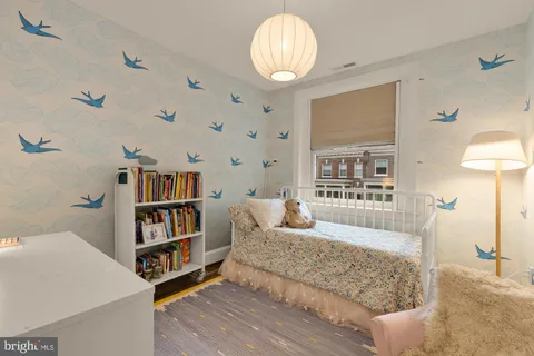 a bedroom with a bed and a view of bathroom