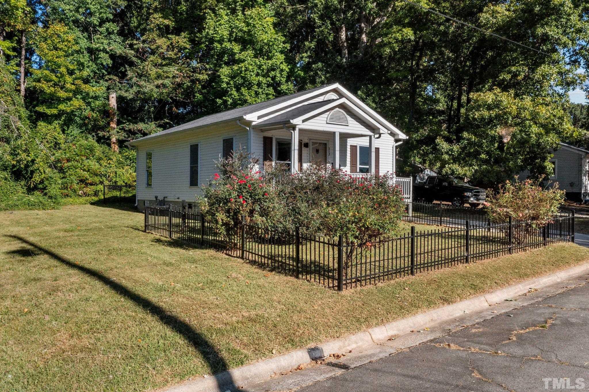 513 Jones Street Roxboro, NC 27573 - Photo 3 of 29 a front view of a house with garden