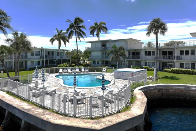 a view of a street with a yard