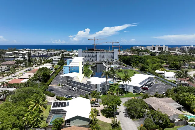 an aerial view of a house with yard swimming pool and outdoor seating
