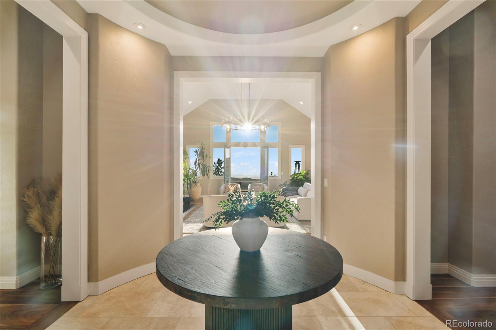730 Genesee Mountain Road Golden, CO 80401 - Photo 4 of 50 a dining room with furniture and a potted plant