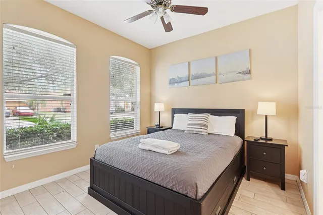 a bedroom with a bed and a window