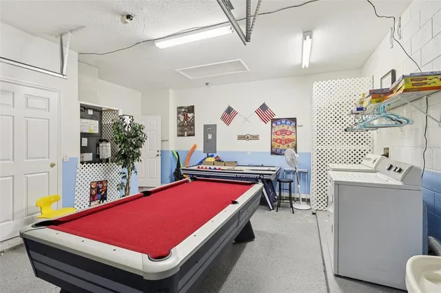 a room with pool table and a flat screen tv