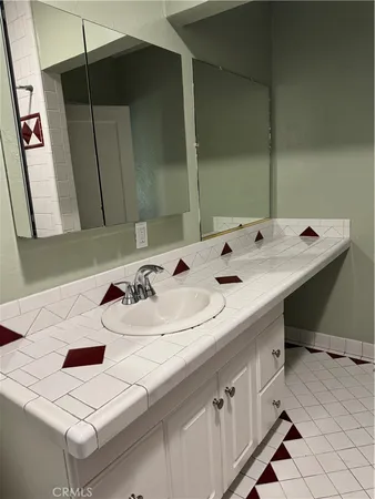 a bathroom with a sink and a mirror