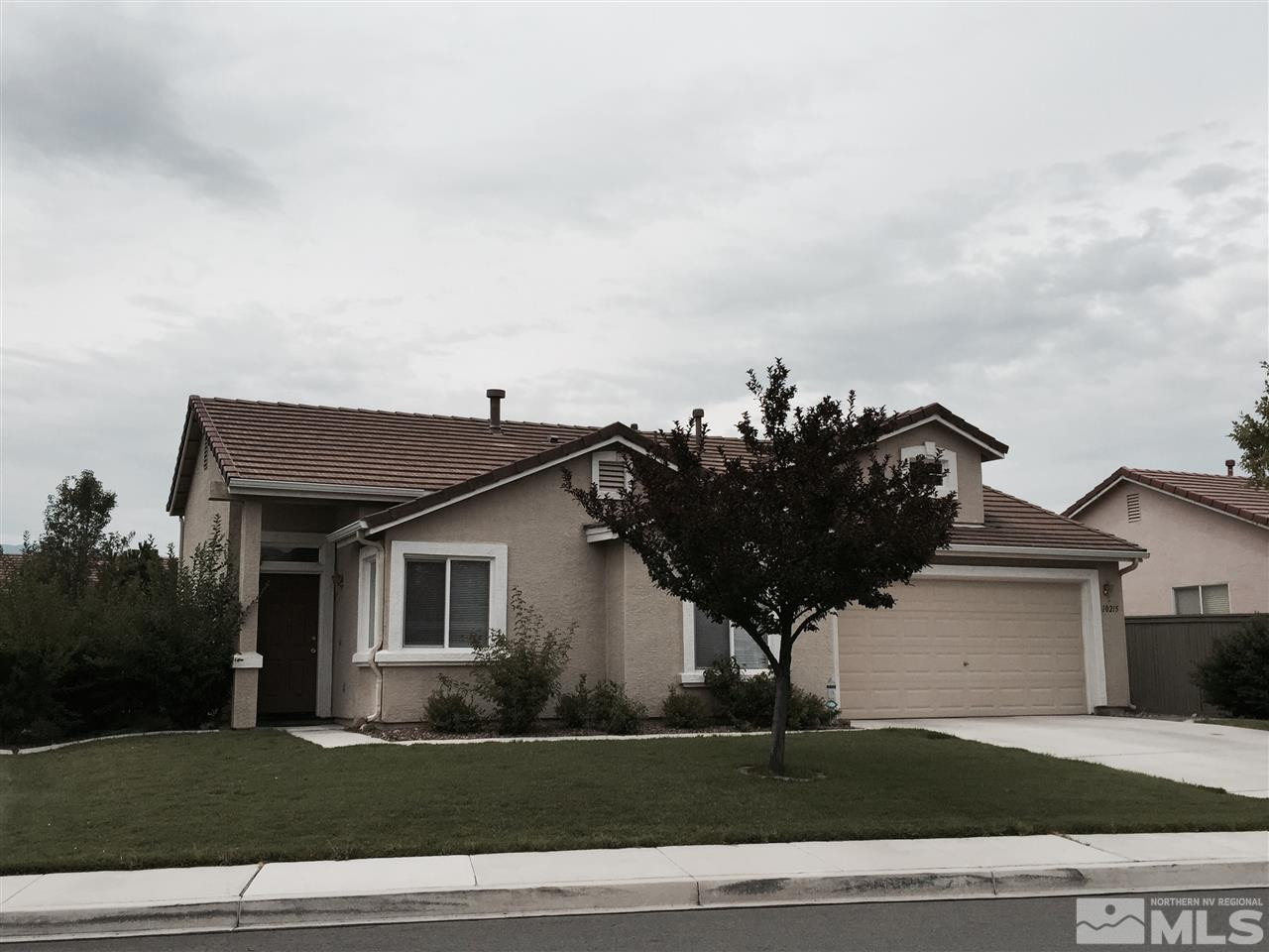 10215 Lucente Way Reno, NV 89521 - Photo 1 of 1 a view of a house with a yard