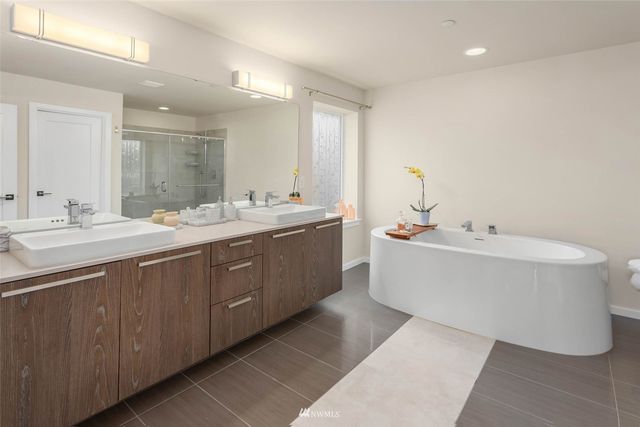 a bathroom with a double vanity sink mirror and double